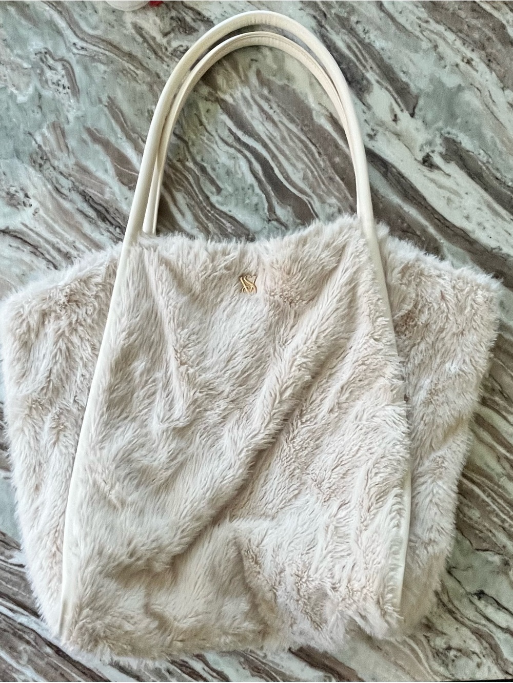 Cream Victoria’s Secret Faux-Fur Tote Bag with gold VS logo